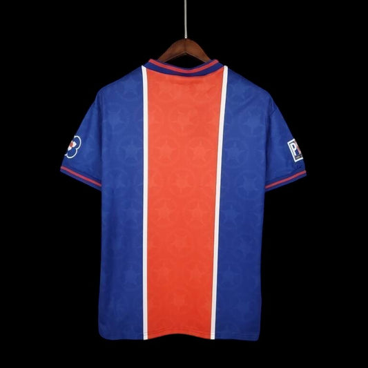 My Store 4 Maillot de football vintage bleu roi avec bande centrale rouge et blanche, motif étoiles ton sur ton.