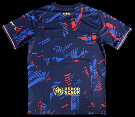 Maillot de football My Store 4 bleu marine avec motif abstrait bleu et rouge, liserés roses sur les manches.
