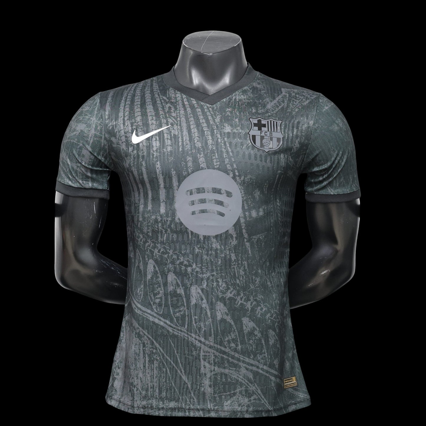 Maillot de football FC Barcelone 2023/2024 domicile homme My Store 4, gris foncé avec motif graphique, logo club et Swoosh Nike.