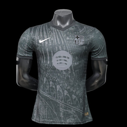 Maillot de football FC Barcelone 2023/2024 domicile homme My Store 4, gris foncé avec motif graphique, logo club et Swoosh Nike.