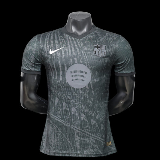 Maillot de football FC Barcelone 2023/2024 domicile homme My Store 4, gris foncé avec motif graphique, logo club et Swoosh Nike.