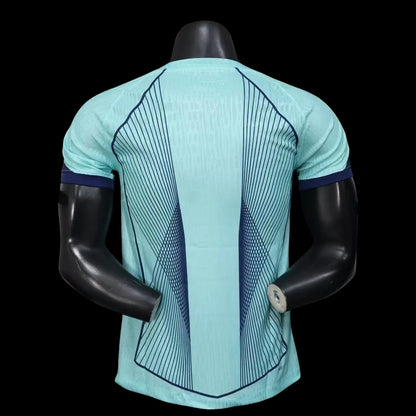 My Store 4 Maillot de football homme bleu sarcelle avec lignes graphiques bleues contrastantes et col bleu marine.