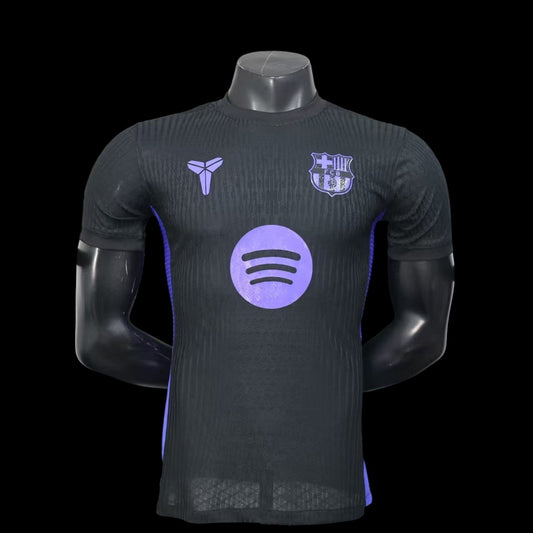 Maillot de football My Store 4 noir avec logo Spotify violet et détails texturés. Tissu respirant.