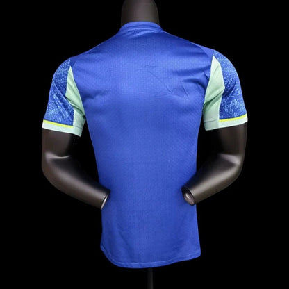 Maillot de football Olympique de Marseille domicile bleu avec accents vert menthe et motif graphique sur les manches. Logo OM et Puma visibles. My Store 4Here.