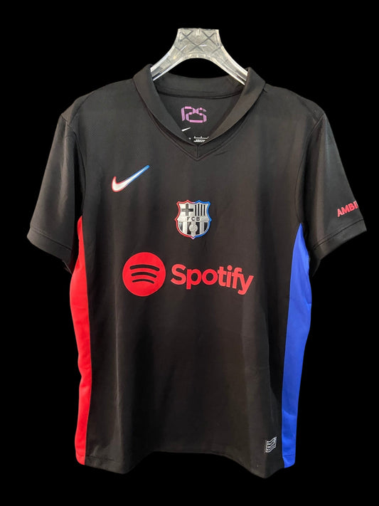 Maillot de football FC Barcelone noir pour homme My Store, avec logos Spotify et UNHCR, touches rouge et bleu électrique.