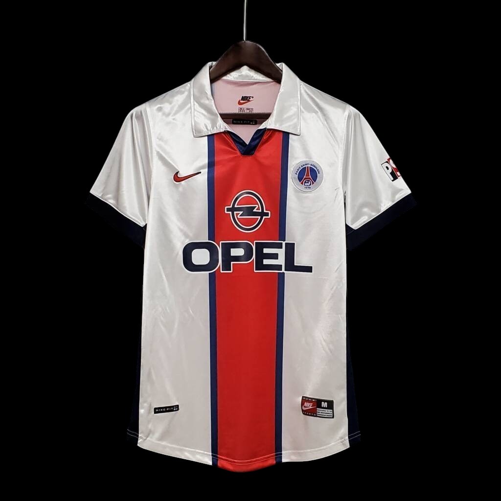 Maillot de football vintage blanc My Store, avec bande centrale rouge, logo Opel et manches bleu marine.